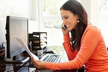 A girl on the phone scheduling an appointment