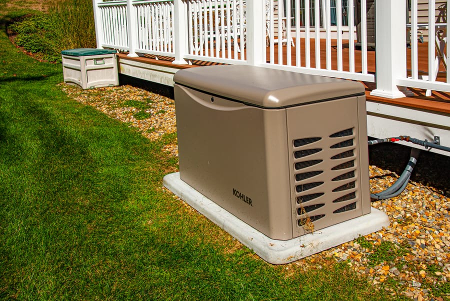 Residential generator on the lawn.